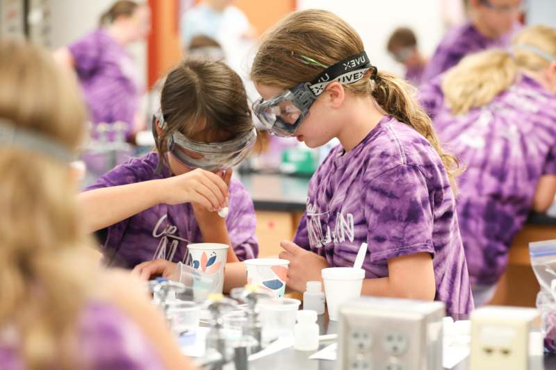 a group of girls wearing safety goggles and protective glasses