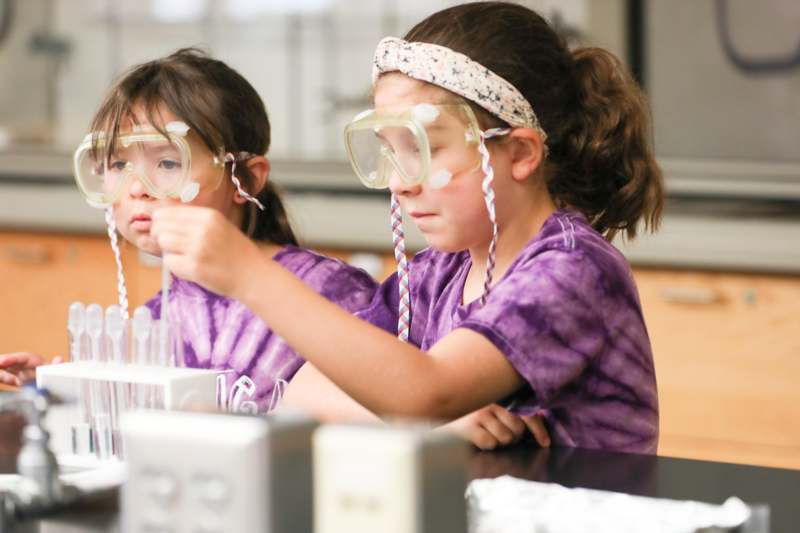 a group of girls wearing safety goggles
