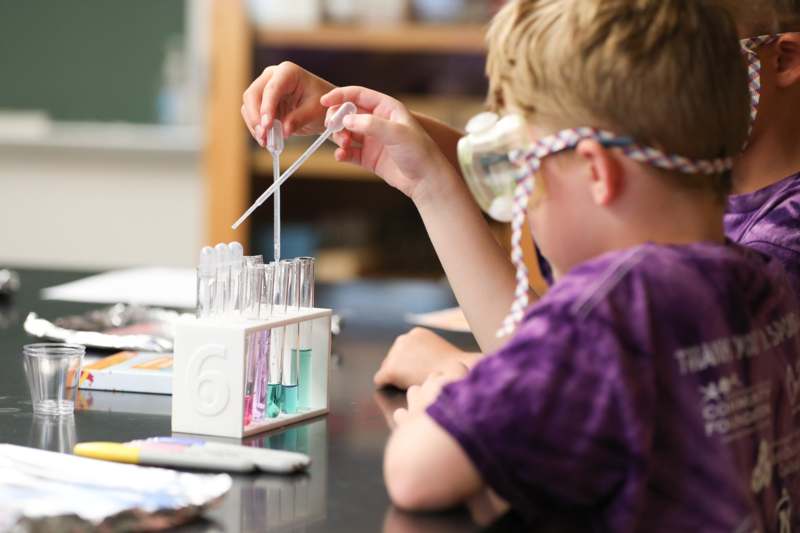 a group of kids in a lab
