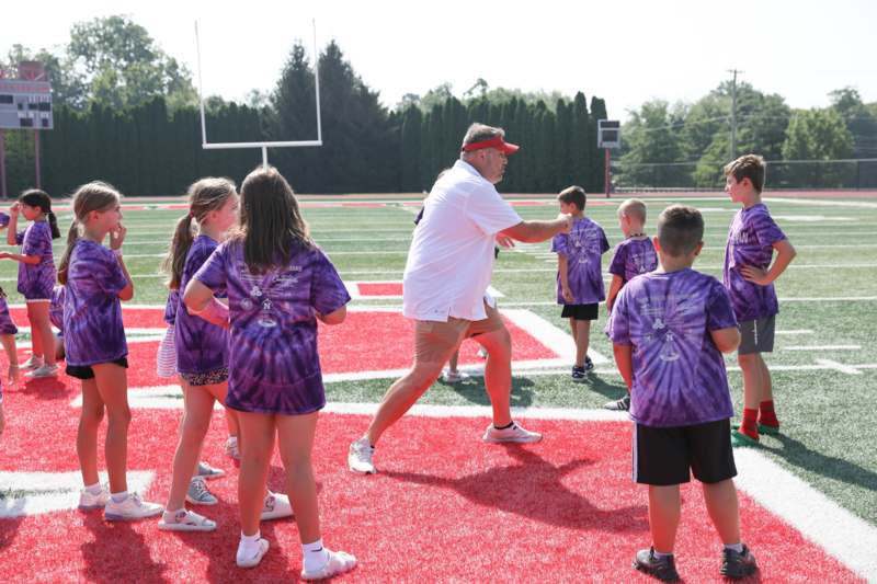 a group of children on a football field