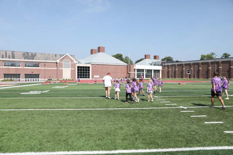 a group of people on a football field