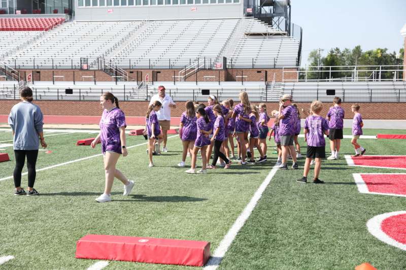 a group of children on a football field