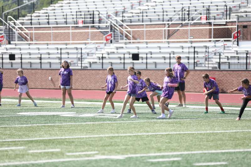 a group of people on a football field