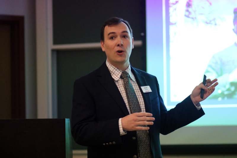 a man in a suit speaking