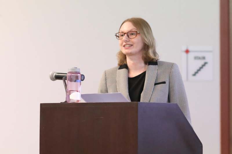 a woman standing at a podium