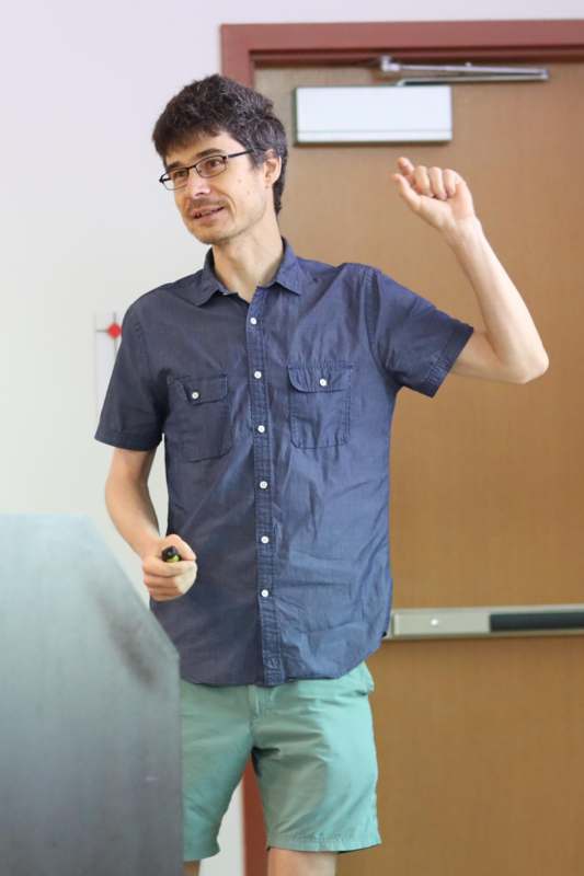 a man standing in front of a whiteboard