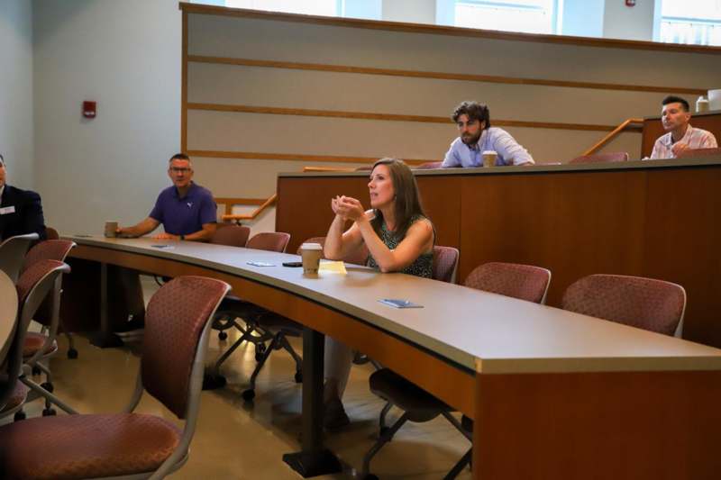 a group of people sitting at a table