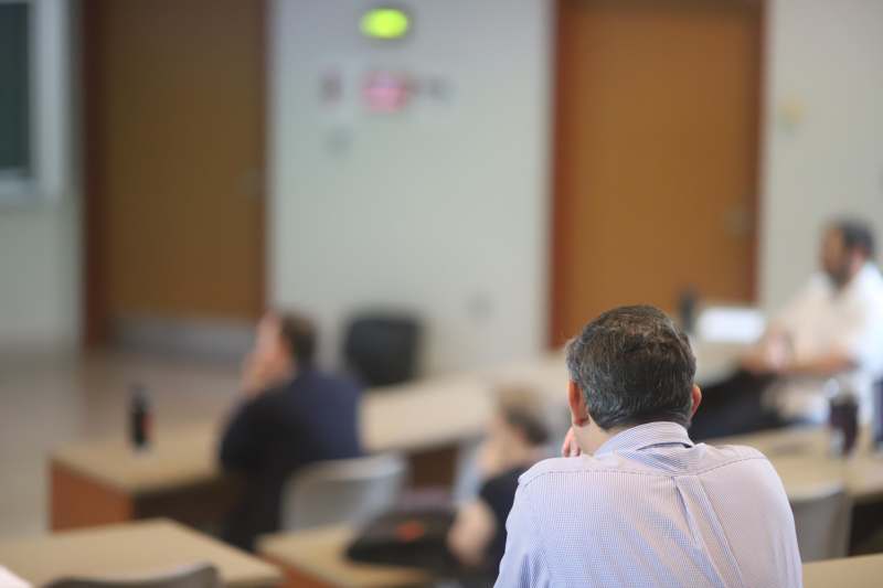 a man sitting in a classroom