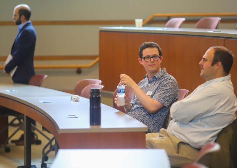 a man holding a bottle of water