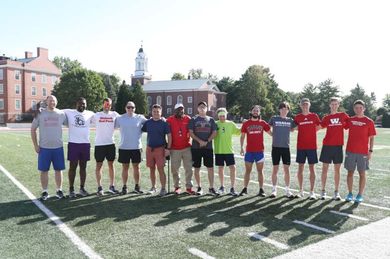 a group of people standing on a football field