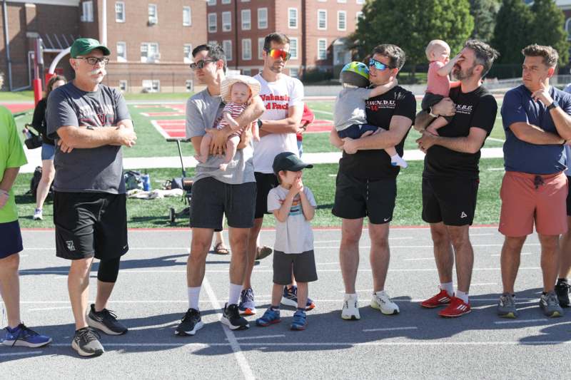 a group of people standing on a track