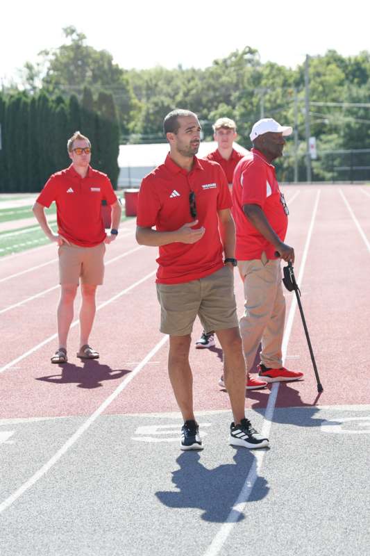 a group of men on a track