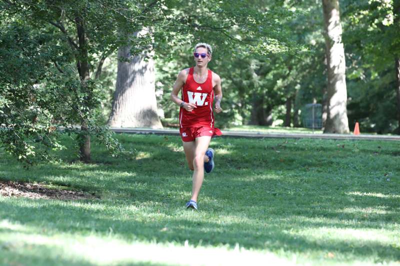 a woman running in a park