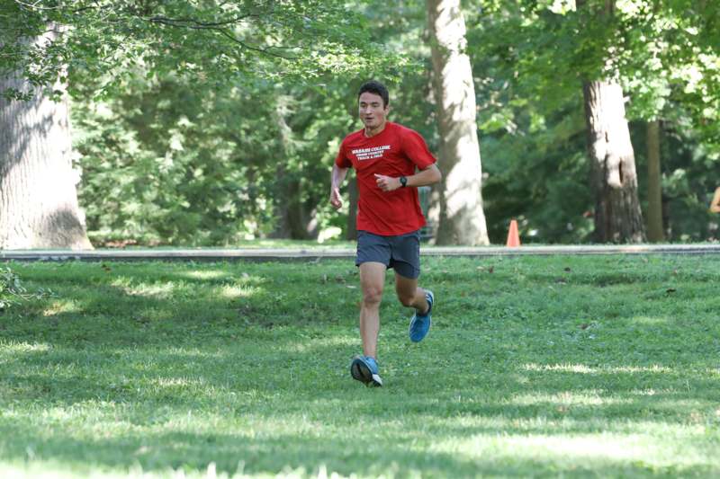 a man running on grass