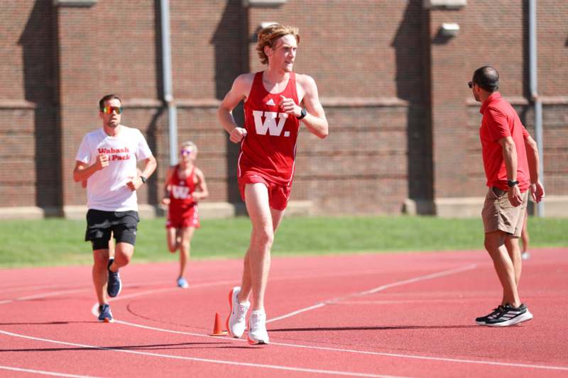 a group of people running on a track