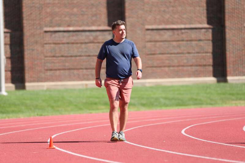 a man walking on a track
