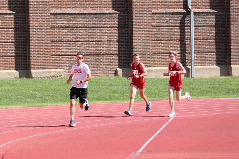 a group of people running on a track