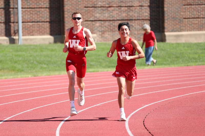 two men running on a track
