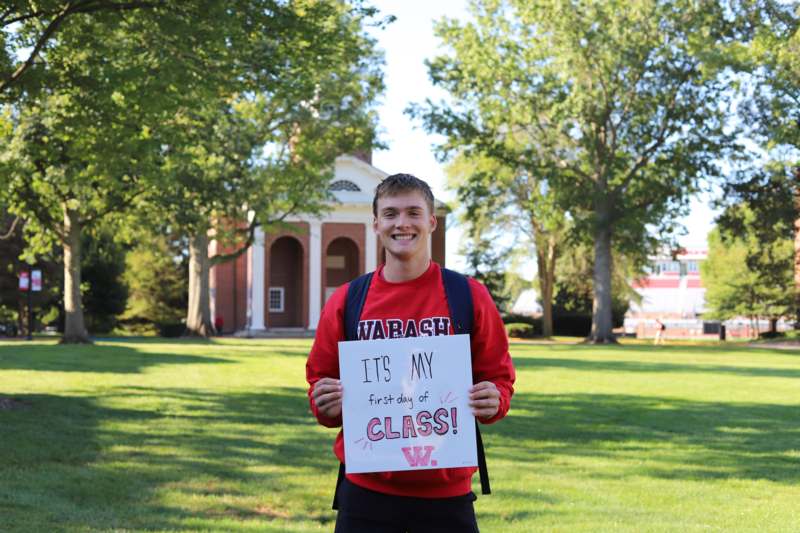 a man holding a sign