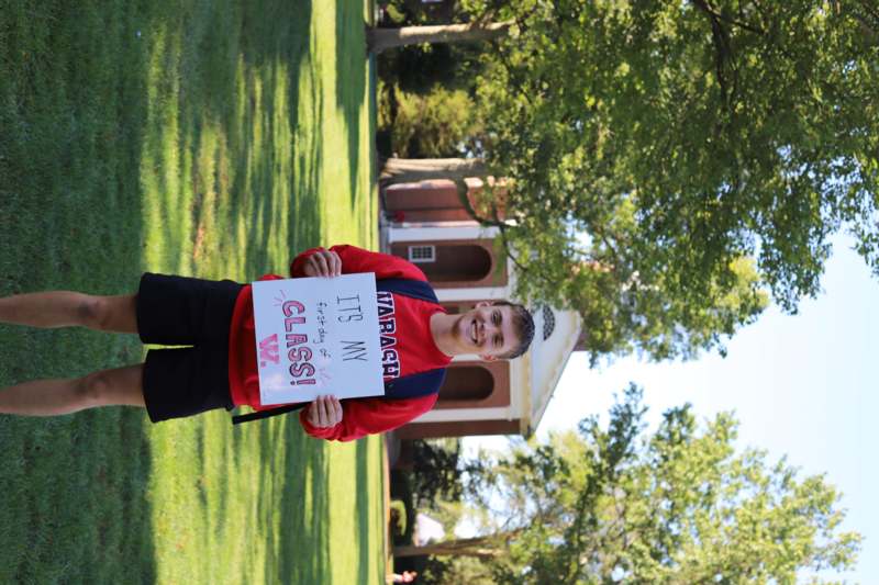 a man holding a sign