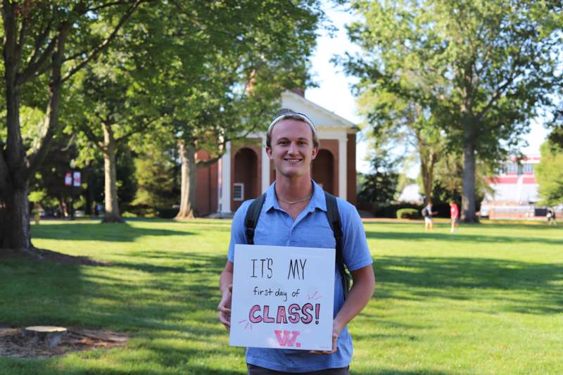 a man holding a sign