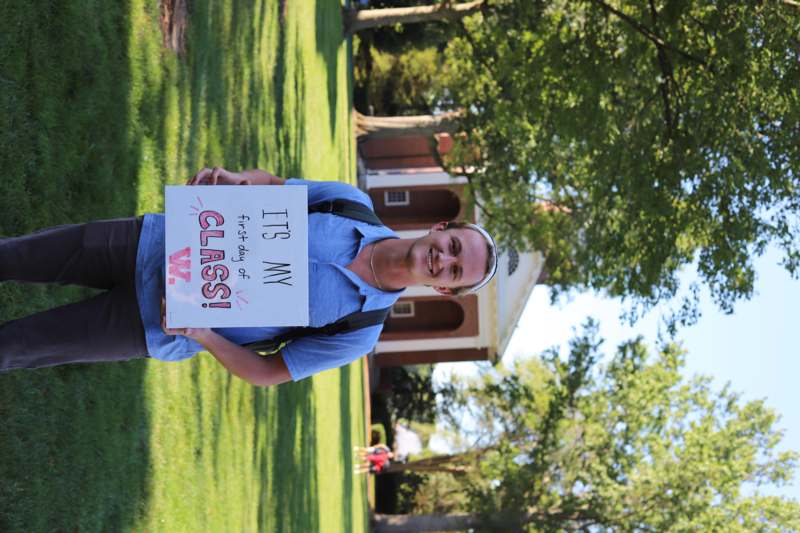 a man holding a sign