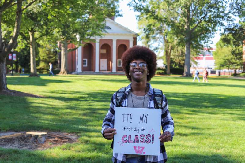 a man holding a sign