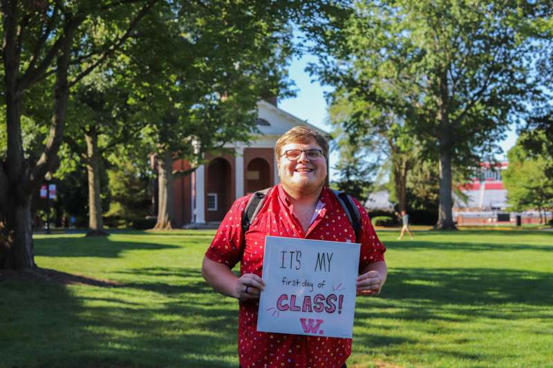 a man holding a sign