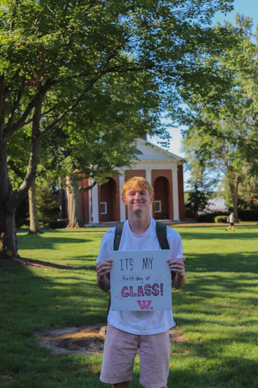 a man holding a sign