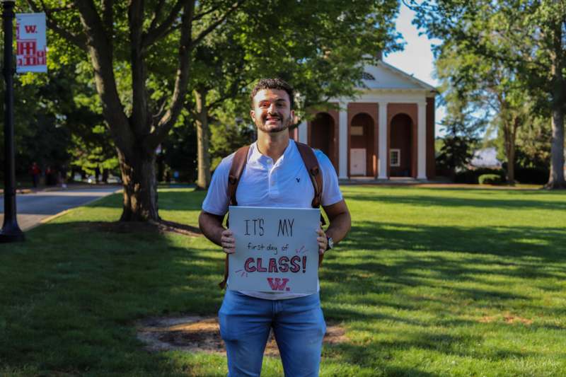a man holding a sign