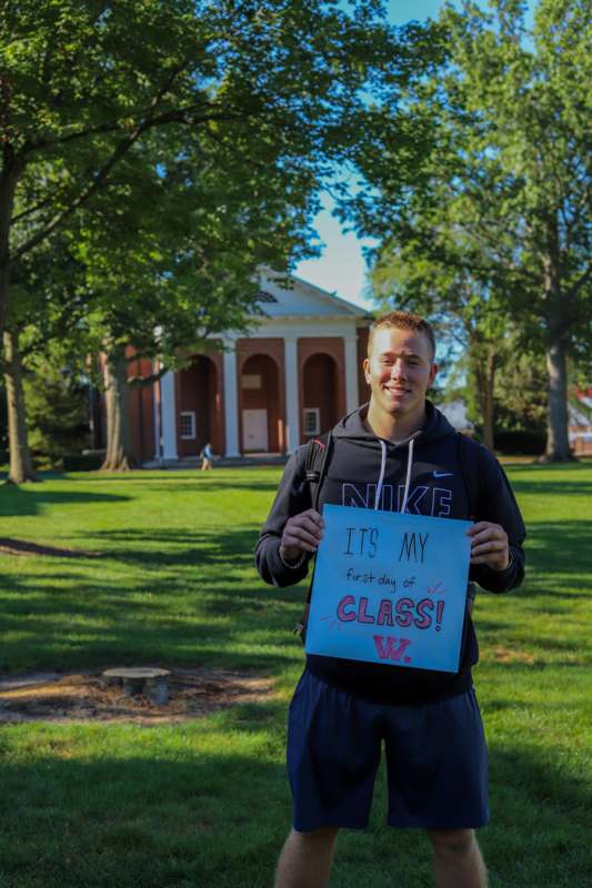 a man holding a sign