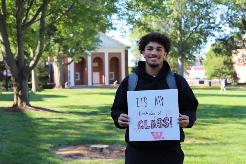 a man holding a sign