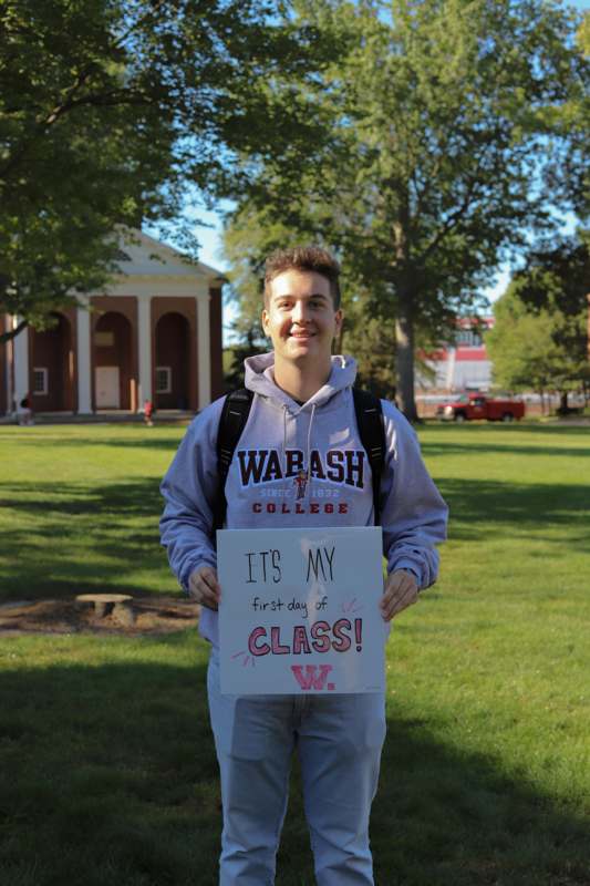 a man holding a sign