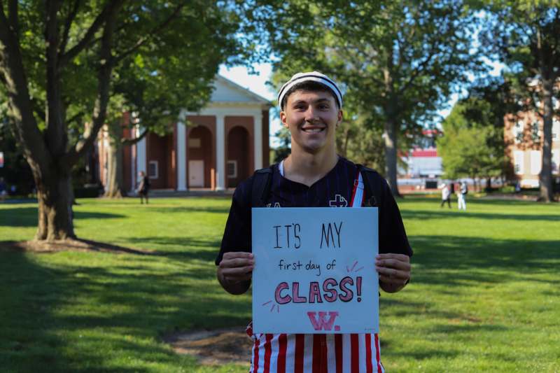 a man holding a sign