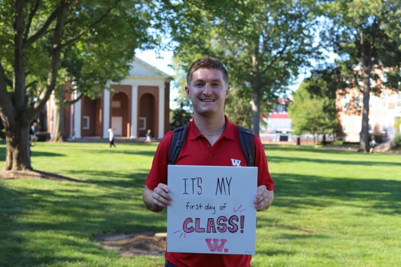 a man holding a sign