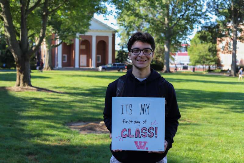 a man holding a sign
