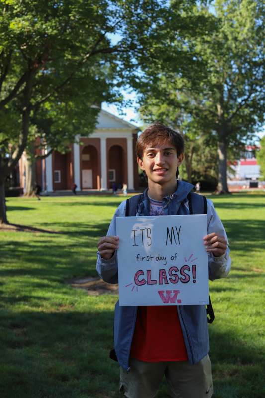 a boy holding a sign