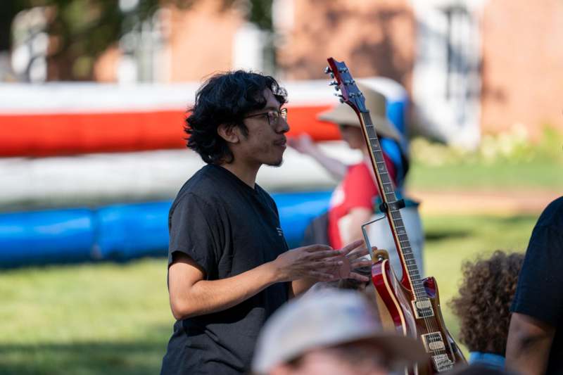 a man playing a guitar