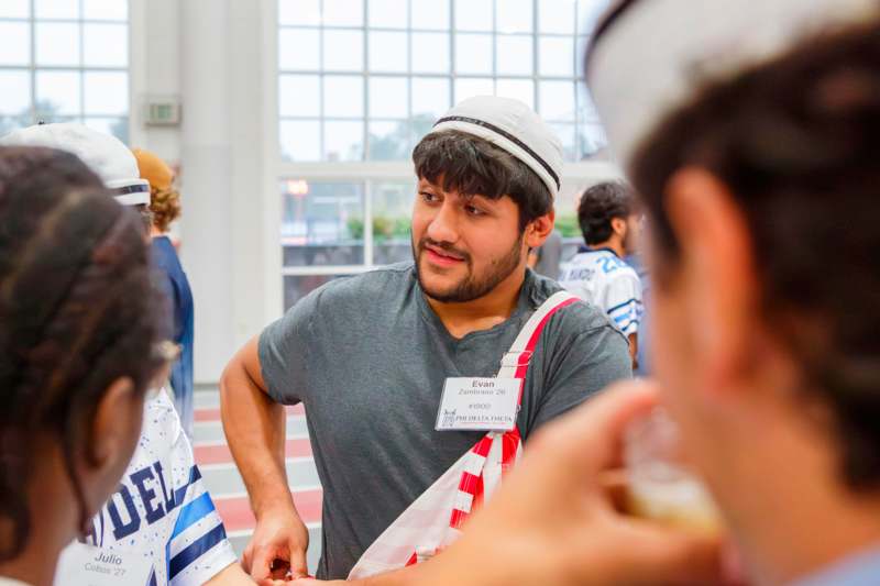 a man wearing a hat and a badge