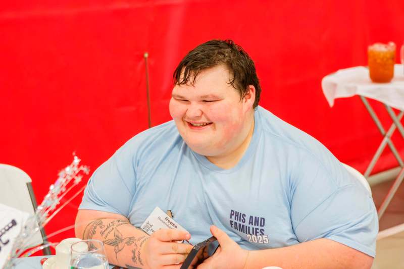 a man smiling at the camera