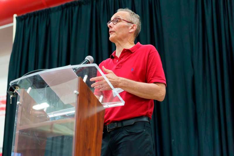 a man standing at a podium
