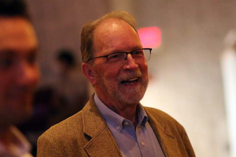 a man in a brown jacket