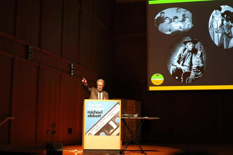 a man standing at a podium