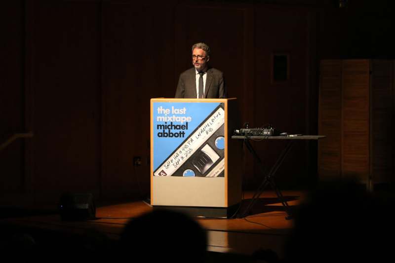a man standing at a podium
