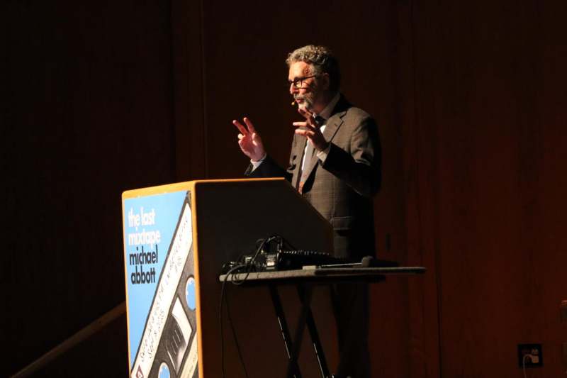 a man standing at a podium giving a speech