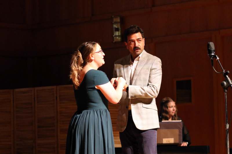 a man and woman holding hands