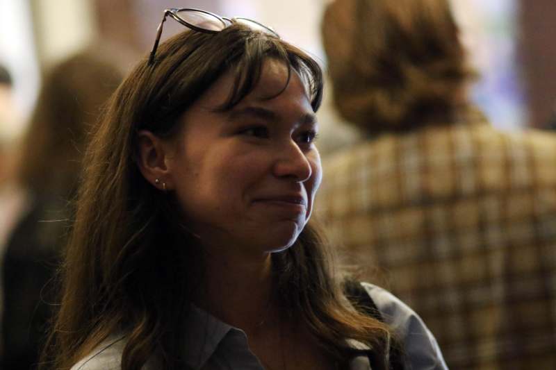 a woman with glasses on her head