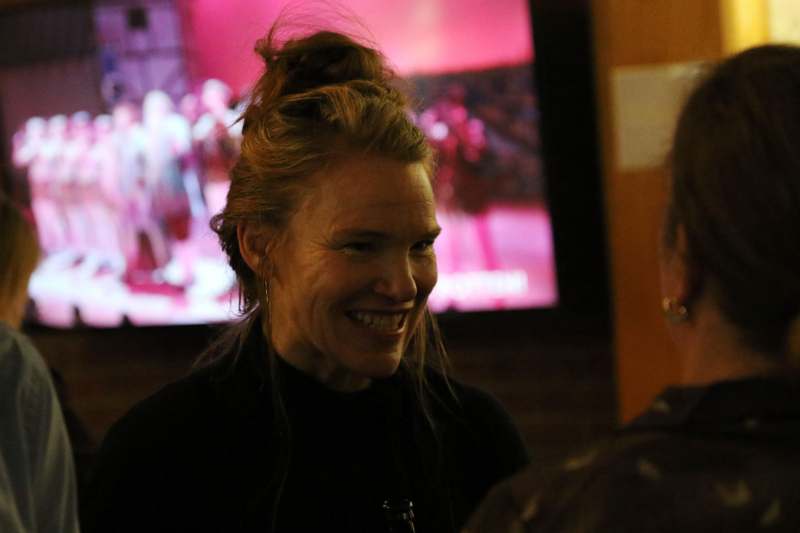 a woman smiling at a man
