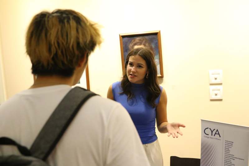 a woman talking to a man