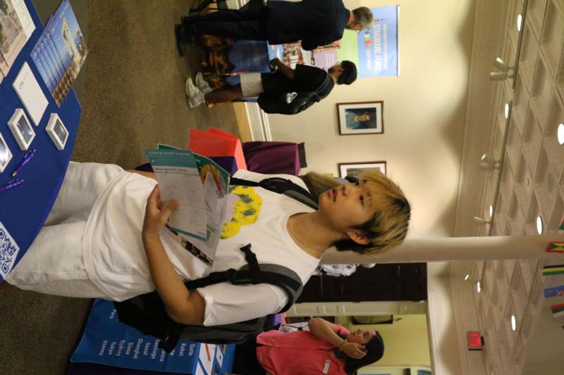 a man holding a paper